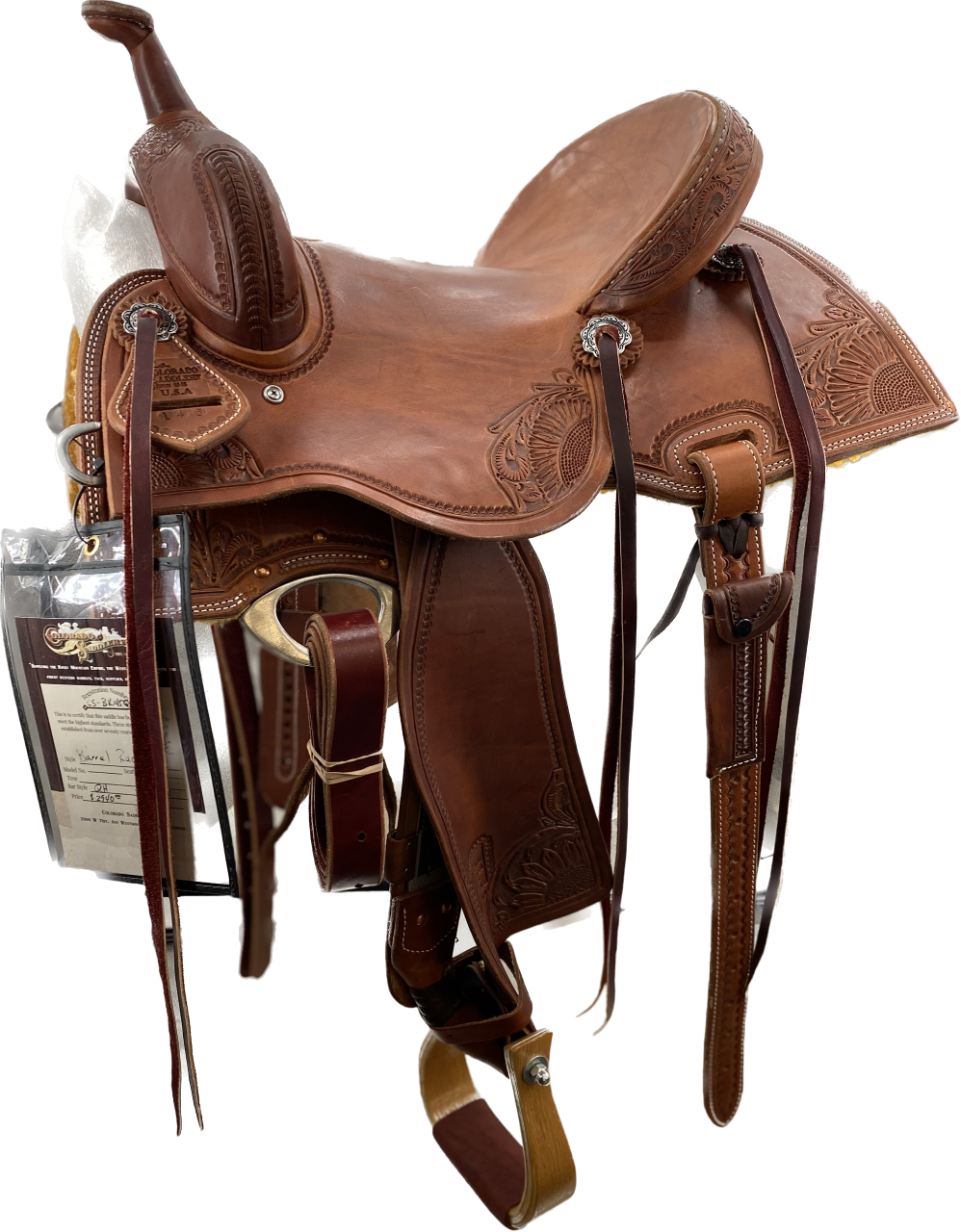 A brown Barrel Racer saddle designed for competitive barrel racing, featuring a lightweight design, deep seat, high cantle, and premium leather construction.