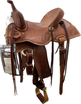 A brown Barrel Racer saddle designed for competitive barrel racing, featuring a lightweight design, deep seat, high cantle, and premium leather construction.
