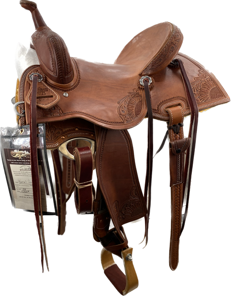 A brown Barrel Racer saddle designed for competitive barrel racing, featuring a lightweight design, deep seat, high cantle, and premium leather construction.