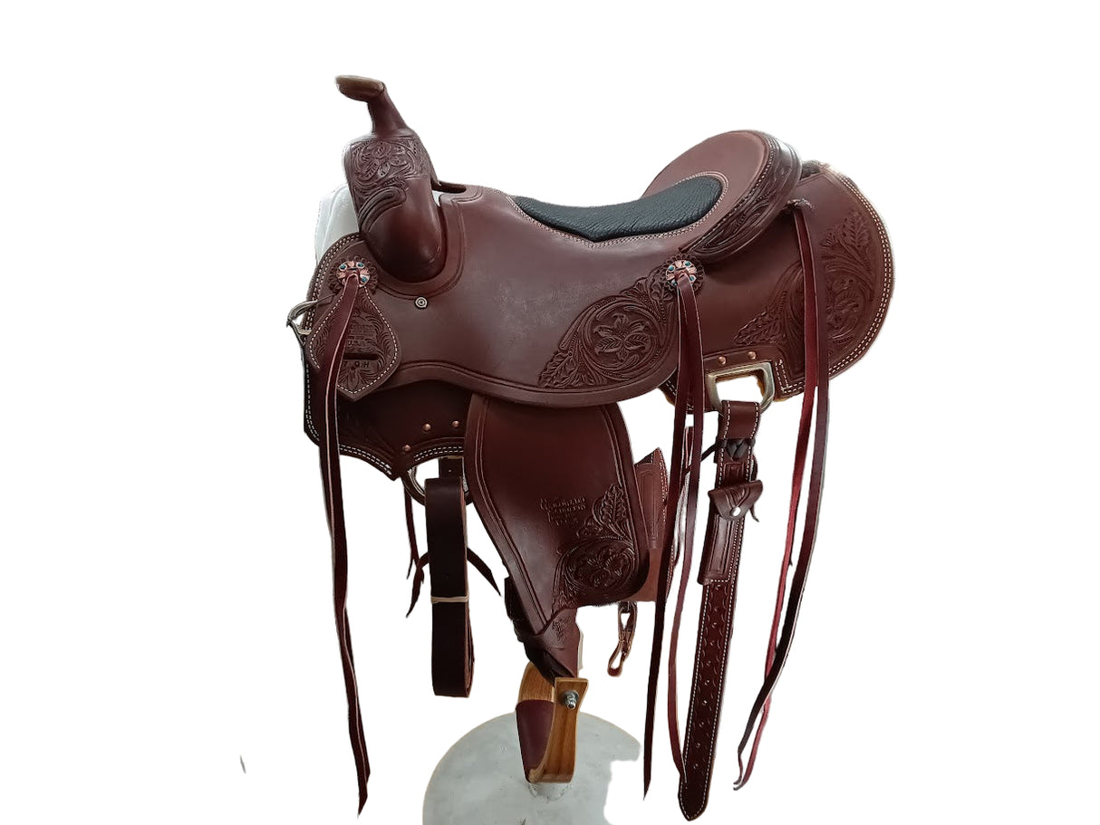 Brown leather saddle on a white background