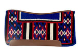 Colorful patterned saddle pad with brown accents on a white background