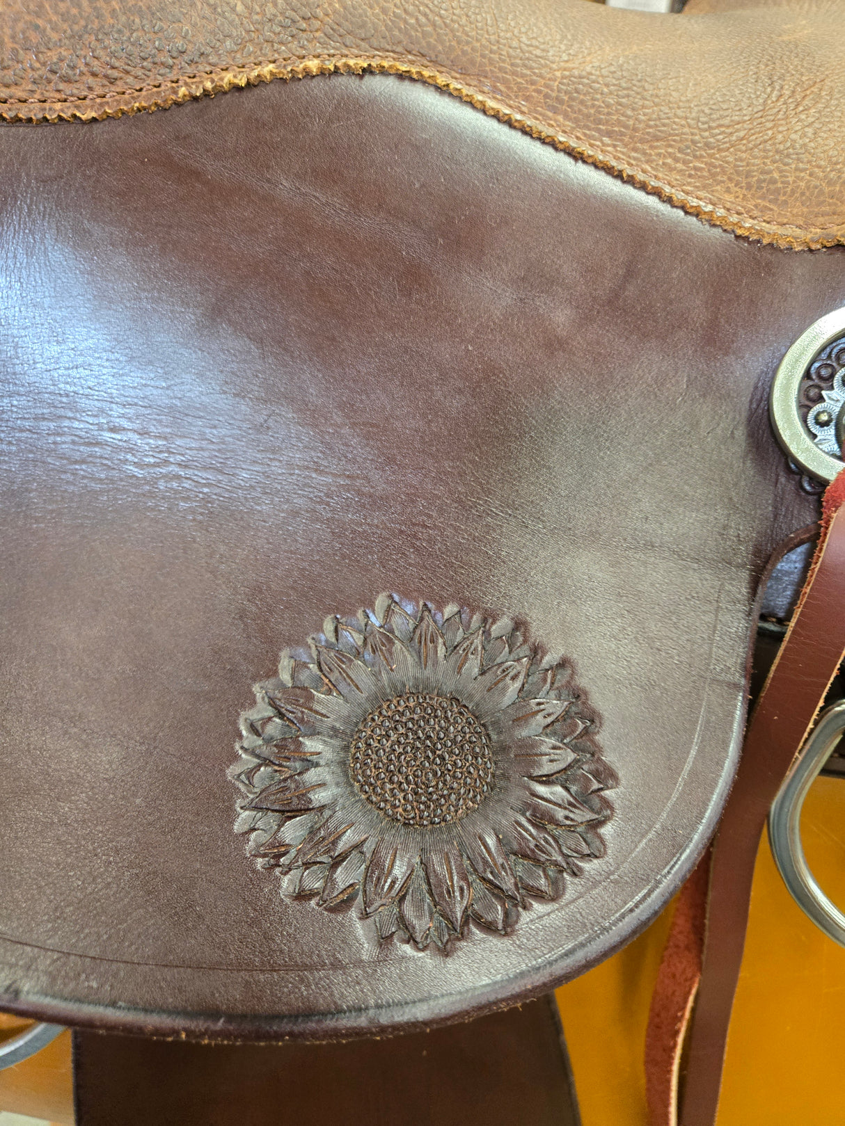 Brown leather saddle with tooling
