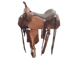 A tooled barrel leather western saddle with a dark brown seat