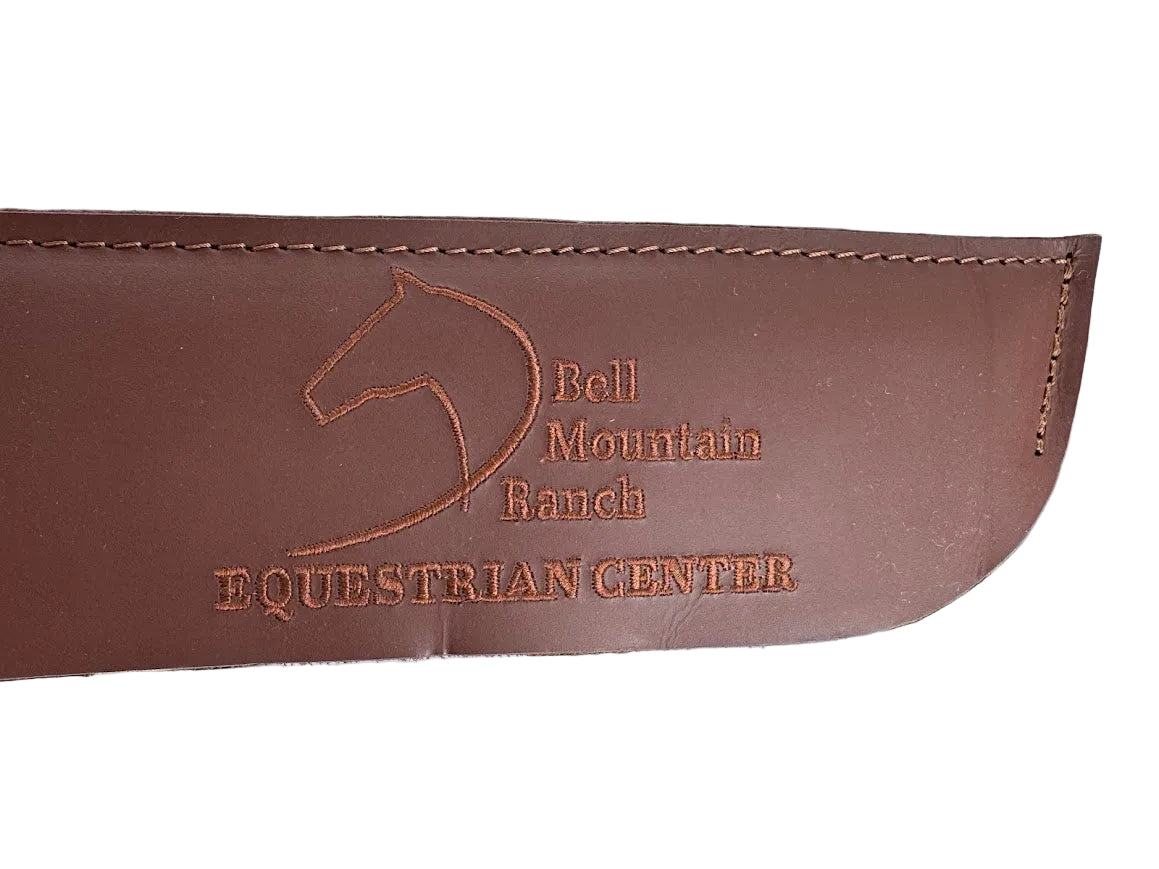 Natural Cream Color 100% Pressed Wool Saddle Pad with Brown Stitching and Leg Relief. Bell Mtn. Logo