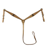 A brown leather horse breast collar with a cross design in the front and a attached lead line.